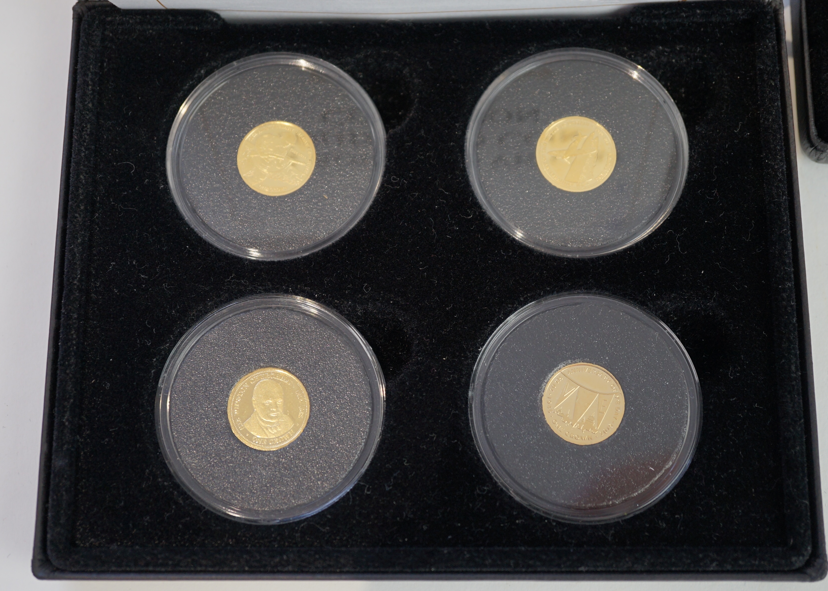 Gold commemorative coins, Elizabeth II, Tristan da Cunha, The route to victory 9ct. gold crown four coin collection, each 1g and the 75th anniversary of the Battle of Britain 9ct. gold crown pair, each 1g, each set in a